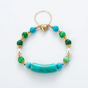 Handmade Bohemian turquoise pearl bracelet featuring a heart magnetic clasp and gold beads