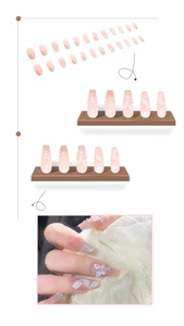 Macro detail of nude pink press-on nails with 3D crystal butterflies and pearls