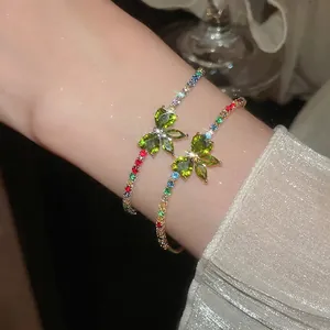 Sparkling zircon butterfly cross pendant bracelet with colorful stones and gold finish