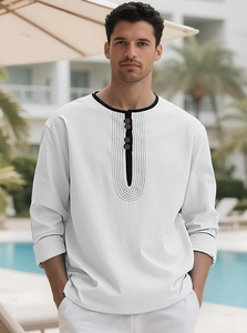 Detail of white Henley shirt featuring black collar trim and button neckline for men