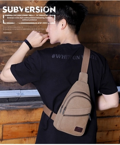 Detail view of coffee canvas chest bag featuring multi-pocket design and leather logo patch