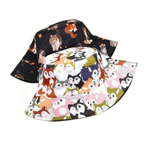 Cartoon animal print bucket hats in black and white styles with cat patterns