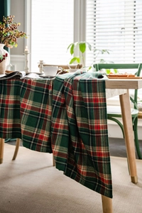 Close-up of green and red plaid tablecloth in rustic cotton linen blend fabric