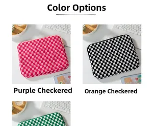Close-up of checkered knit laptop sleeves in purple, black, and green with zippers