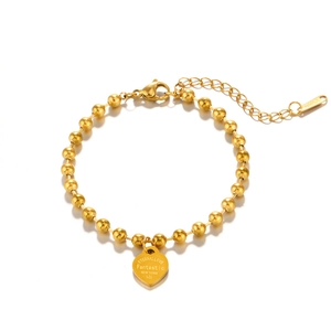 Golden stainless steel bead bracelet with engraved heart charm and lobster clasp