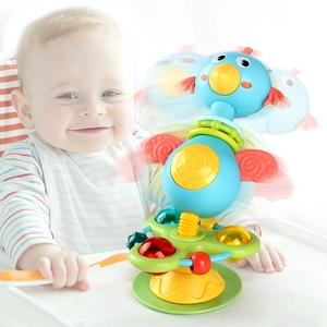 Baby suction cup high chair toy with colorful spinning rings and cute bird design
