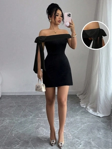 Elegant black off-shoulder mini dress featuring a large shoulder bow and slim A-line fit