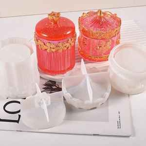 Close-up of carousel storage jar silicone molds with glitter resin finished products