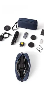 Macro view of partitioned storage bag for camera accessories and data cables