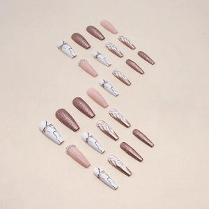 Long ballerina press-on nails featuring marble texture, glitter, and pearl accents