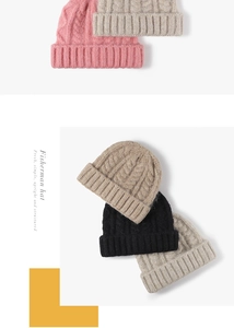 Close-up of thick cable knit pattern and folded cuff on winter beanies in various colors