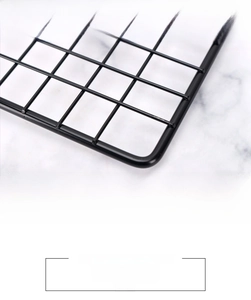 Detail of black non-stick baking rack showing stable curved legs and safe rounded corners