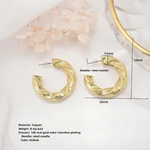 Polished 18k gold plated hollow twisted C-shape hoop earrings with 32mm diameter