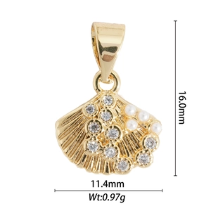Detailed view of a gold scallop pendant with pearls and stones, size 16x11.4mm