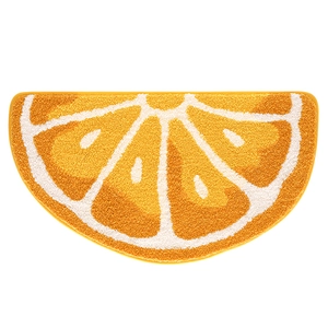 Semi-circle orange slice bath mat with soft plush texture and high water absorption