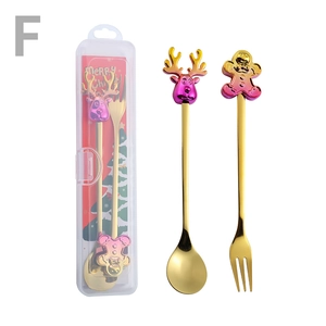 Christmas spoon and fork set in gold metal with colorful cartoon reindeer ornaments