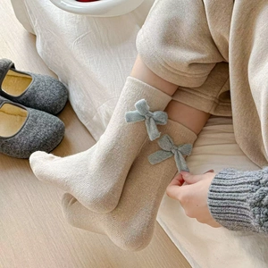 Japanese style wool blend crew socks in beige with blue ribbon bows and ribbed texture