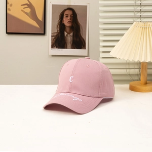 Pink baseball cap with white C embroidery and Chicago print on brim, cotton fabric