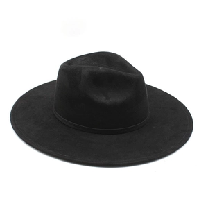 Close-up of black suede wide brim fedora hat with classic indented crown and band