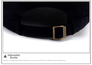 Close-up of adjustable bronze metal buckle and fabric strap on casual washed flat top cap