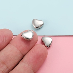 Polished silver heart-shaped stainless steel beads for DIY jewelry making and crafts