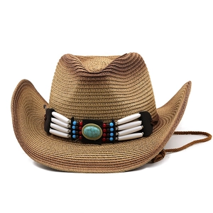 Detailed close-up of woven straw cowboy hat featuring ethnic beads and turquoise stone