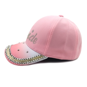 Close-up of pink gradient baseball cap with sparkling Bride rhinestone lettering on side
