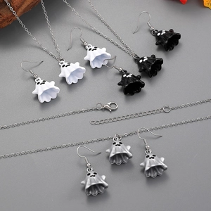Detail of ghost pendant jewelry set including earrings and adjustable necklaces