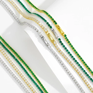 Elegant gold and silver tennis necklaces with green emerald and clear zirconia stones