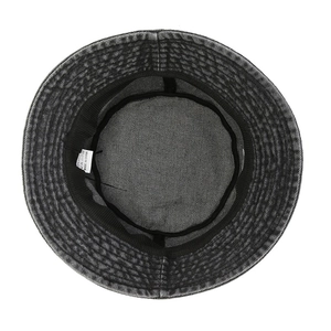 Interior view of washed dark grey denim bucket hat showing 100% cotton label and stitching