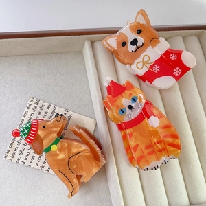 Pinze per capelli natalizie con simpatici animali come Corgi, Golden Retriever e Gatto