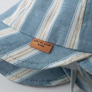 Striped baby sun hat in blue and white cotton fabric with adjustable chin strap