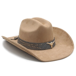 Detail of khaki suede cowboy hat featuring a bull head metal buckle and silver studs