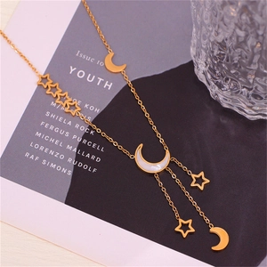 Golden star and moon necklace with white shell tassel pendant for a stylish women's look