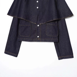 Front view of deep blue denim jacket featuring a stylish cape design and silver buttons