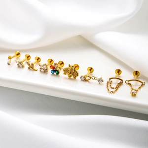 Golden G23 titanium labret studs set with zircon bees, butterflies and flower designs
