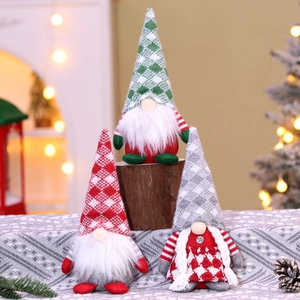 Detailed close-up of three knitted Christmas gnomes with plaid hats and long white beards
