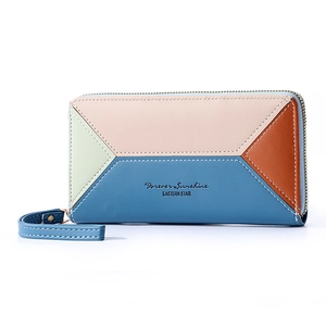 Detail view of multi-color paneled leather wallet with zipper and hand strap