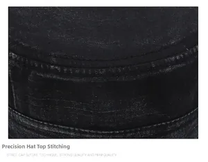 Detailed close-up of double-stitched seams on a black vintage washed cotton military cap