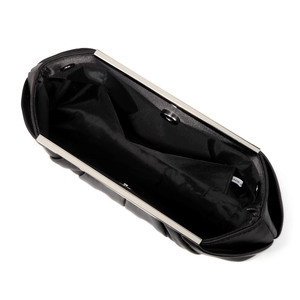 Interior detail of black pleated evening clutch bag with silver frame and inner pocket