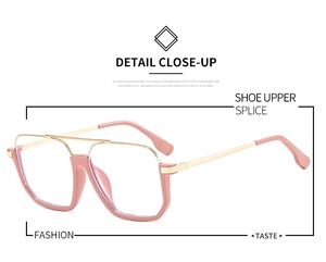Detail of pink and gold oversized square glasses frame with a double bridge design