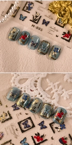 Detail of oil painting style press-on nails with blue butterfly and gold foil patterns