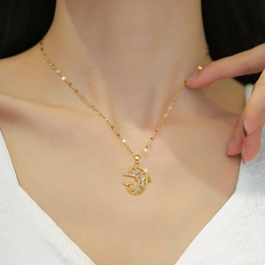 Elegant gold titanium necklace featuring a sparkling zircon dolphin pendant on a fine chain