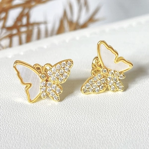 Elegant gold butterfly studs featuring white mother of pearl and sparkling zircon stones