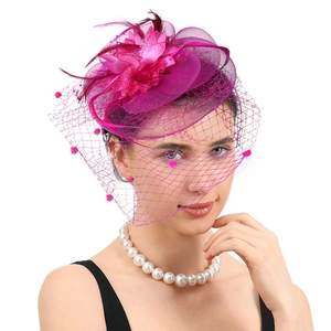 Elegant rose red fascinator hat with mesh veil and feathers for wedding or tea party