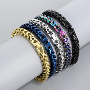 Men's stainless steel dragon bone chain bracelets in five metallic colors on display