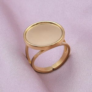 Macro view of adjustable gold-plated stainless steel ring base on purple silk