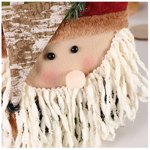 Detail view of plush Christmas gift bag with Santa Claus knitted texture and faux fur