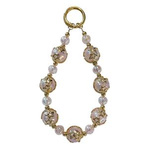 Porte-clés en perles roses craquelées avec breloques étoiles dorées et mousqueton