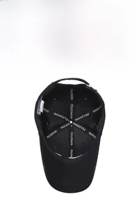 Detailed interior of black baseball cap showing reinforced seams and branded inner tape